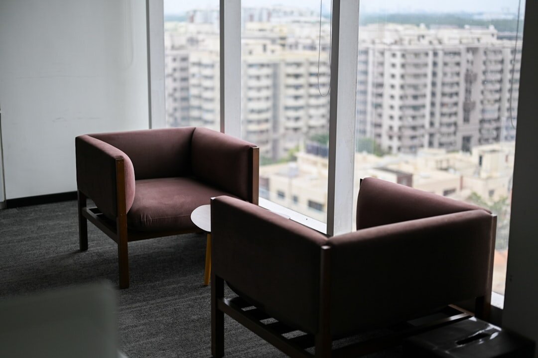 Empty modern office meeting room with large windows
