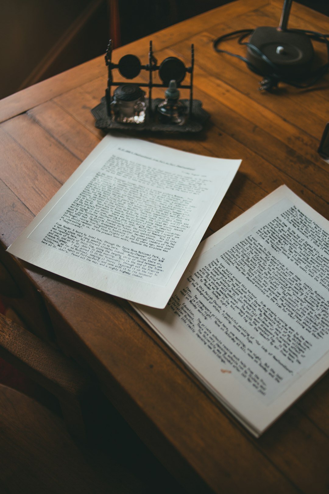 Legal documents and pen on a wooden desk